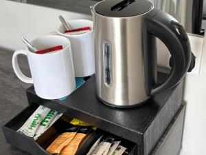 a coffee pot sitting on top of a shelf at Amorist Hotel in Dunfermline