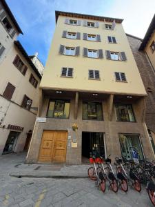 a group of bikes parked in front of a building at Wine Apartments Florence Malvasia in Florence