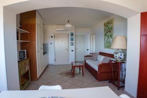 a living room with a couch and a table at L'Appartamentino in Casa Donato +14 photos