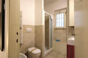 a bathroom with a toilet and a shower and a sink at Wine Apartments Florence Malvasia in Florence