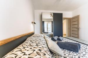 a bedroom with a large bed and a mirror at Milina Residence - Lumbarda in Lumbarda