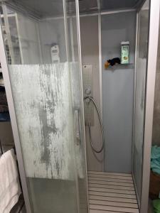a shower with a glass door in a bathroom at Villa Champigny in Champigny-sur-Marne +14 photos