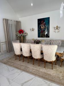 a dining room with a table and chairs at Villa Champigny in Champigny-sur-Marne