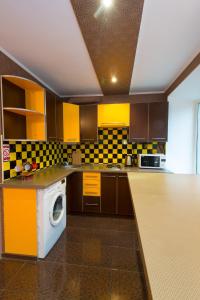 a kitchen with a washing machine in the middle at Tiraspolska 2a Very center in Kherson