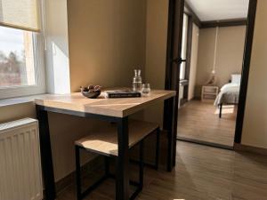 a small table in a room with a bedroom at Shpola Central Hotel in Shpola +15 photos