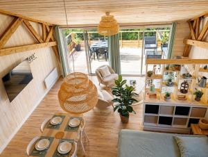 a living room with a couch and a table at ty loft keremma in Tréflez