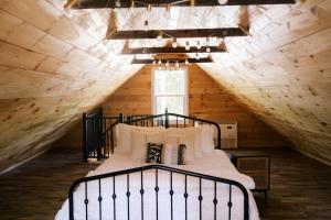 a bedroom with a large bed in a attic at Pine Creek Farm in Burkeville +127 photos
