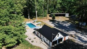 an overhead view of a house with a swimming pool at Pine Creek Farm in Burkeville