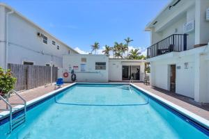 a swimming pool in the backyard of a house at The Flamingo in Hollywood