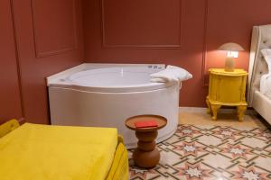 a bathroom with a large tub in a room at Palazzo Sospiri in Bisceglie +41 photos