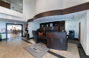 a lobby with a restaurant with a bar in it at Prestige Prince George Lodge in Prince George +108 photos