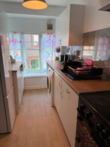 a kitchen with a sink and a counter top at Well St Apartment in Moffat