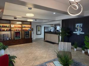 a lobby of a restaurant with a bar at Spanish Trails Inn - Laredo Hotel in Laredo +21 photos