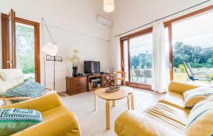 a living room with two couches and a tv at Amedart in Alcudia +19 photos