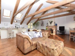 a living room with a couch and a table at 5 Bed in Colintraive oc-74117 in Colintraive