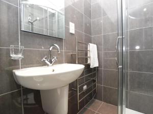 a bathroom with a sink and a shower at 5 Bed in Colintraive oc-74117 in Colintraive +22 photos