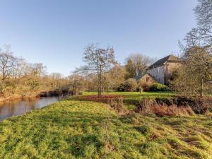 a house on the side of a river at 2 Bed in Beaworthy oc-77555 in Black Torrington +13 photos