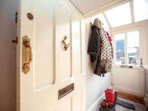 a hallway with a white door and a window at 2 Bed in Richmond oc-74284 in Reeth +11 photos