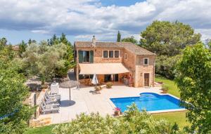 an external view of a house with a swimming pool at Kiana in Santa Eugenia