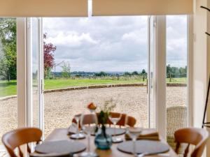 a table with a view of a field through a window at 1 Bed in Corsham oc-83690 in Box