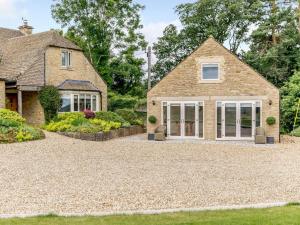 a house with a gravel driveway in front of it at 1 Bed in Corsham oc-83690 in Box