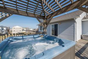 a hot tub on the deck of a house at Carolina Kai, Kitty Hawk MP 3, 275 Yds to Beach, Ocean View, Pool, Hot Tub, Flex Stays in Kitty Hawk