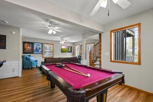 a living room with a pool table in it at Hillside Happiness GameRoom Grill Firepit MORE in Sevierville