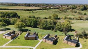 an aerial view of a group of buildings in a field at Nestledstays – The Nest in Binsted +40 photos