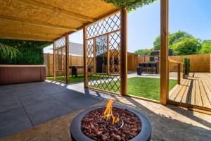 a fire pit in the middle of a patio at The Cabin in Mountfield