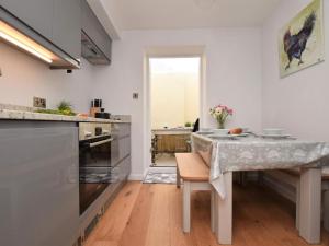 a kitchen with a table and a dining room at 2 Bed in Bideford oc-75307 in Appledore