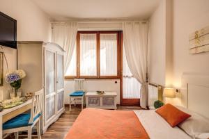 Krevet ili kreveti u jedinici u okviru objekta Trastevere Rooms
