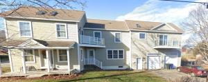 a house with a car parked in front of it at Walk to Willard Beach in South Portland