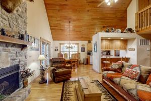 a living room with a couch and a fireplace at Lost Creek Haven in Branson West