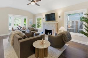 a living room with a couch and a fireplace at Coastal Charm in Santa Cruz