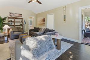 a living room with a couch and a table at Coastal Charm in Santa Cruz