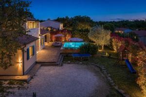 an aerial view of a house with a swimming pool at Villa Martha in Central Istria with private pool - wellness & table tennis for 12 persons in Žminj