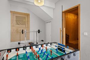 a room with a table with a swimming pool at Villa Martha in Central Istria with private pool - wellness & table tennis for 12 persons in Žminj