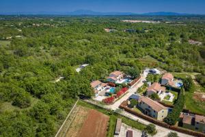 an aerial view of a home in the woods at Villa Martha in Central Istria with private pool - wellness & table tennis for 12 persons in Žminj