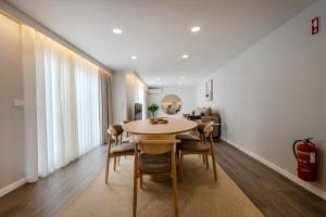 a dining room with a table and chairs at Azor Signature Flats - I in Ponta Delgada