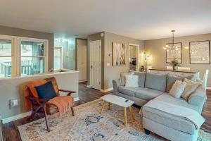 a living room with a couch and a table at The Loblolly in Bella Vista