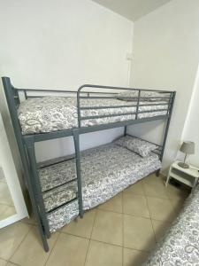 a couple of bunk beds in a room at Renaio House Buti in Bientina