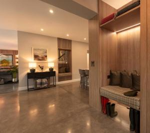 a living room with a bed and a desk at The Residence Ashford in Cong +9 photos