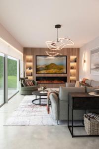 a living room with a couch and a fireplace at The Residence Ashford in Cong