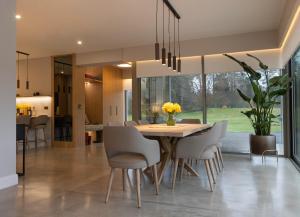 a dining room with a table and chairs at The Residence Ashford in Cong