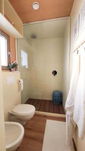a bathroom with a toilet and a sink at CHIC Riverfront Retreat with Private Jacuzzi, BIG BERRY in Gradac