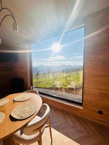 a window in a room with a table and chairs at Яблуневий схил in Tukhlya +29 photos