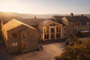 an aerial view of a large brick house at Grains Bar Hotel in Oldham
