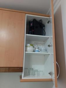 a cupboard filled with lots of dishes at Hotel Villa de Ares in Ares