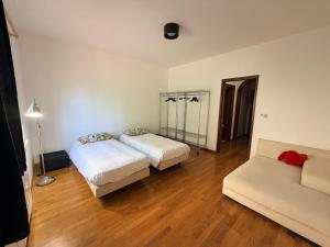 a living room with two beds and a couch at Park House in Mondello +61 photos