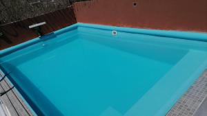 a pool with blue water in a building at Best area and ocean view in Cruz de Huanacaxtle